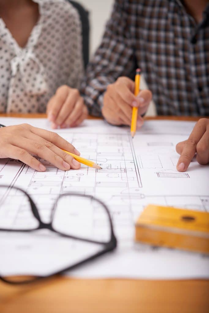 couple looking over blueprints of their home