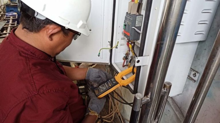 Electrician Installing outlet at home