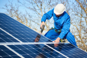 Electrician installing solar panel system