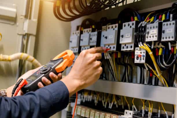 Electrician is fixing the breaker box in Independence