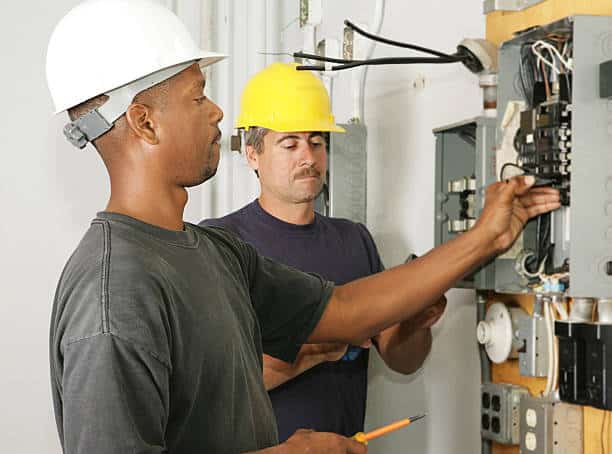 Electrician working on to fix the breaker box in independence