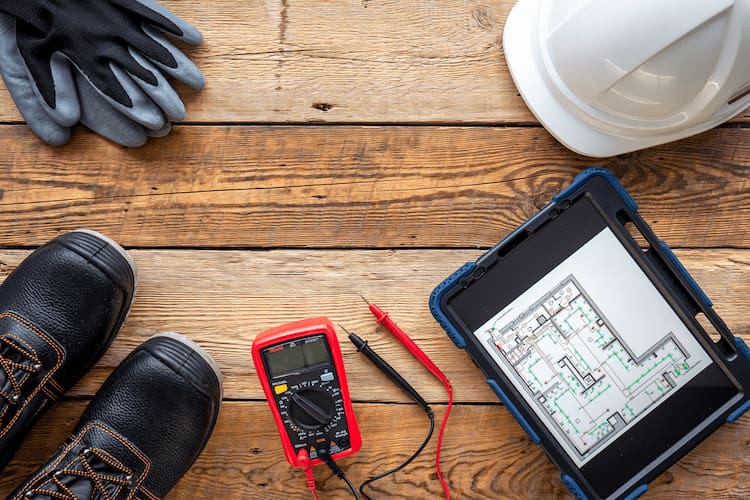 electricians tools laying on wooden floor